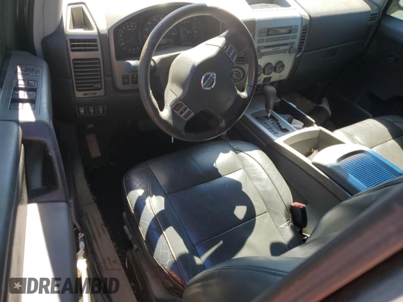 2005 Nissan Titan LE with VIN 1N6BA07B95N571880, listed as a Copart auction lot 57527435 with 199,577 mi miles and Salvage title. Bid and sale history available at DreamBid. Image 8.