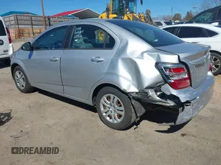 2018 Chevrolet Sonic LS with VIN 1G1JB5SH2J4112817, listed as a IAAI auction lot 41620486 with 60,479 mi miles and . Bid and sale history available at DreamBid. Image 3.