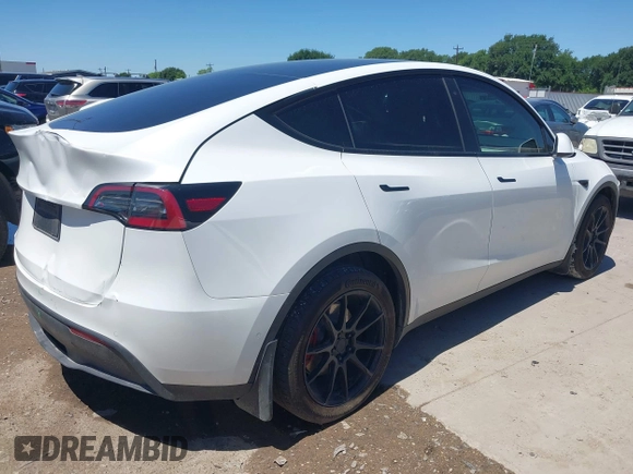 2022 Tesla Model Y Long Range z VIN 7SAYGDEE3NF426481, wystawiony jako IAAI lot #42076729 z przebiegiem 21 648 mil mil oraz . Historia ofert i sprzedaży dostępna na DreamBid. Obrazek 4.