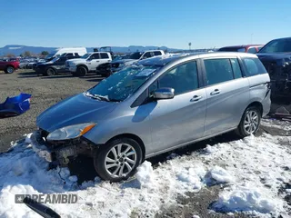 2014 Mazda 5 Sport with VIN JM1CW2BLXE0168119, listed as a IAAI auction lot 41527688 with 142,357 mi miles and . Bid and sale history available at DreamBid. Image 17.