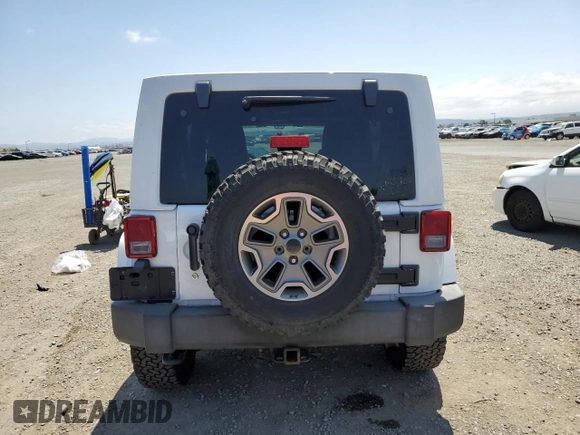 2015 Jeep Wrangler Unlimited Rubicon with VIN 1C4BJWFG6FL508493, listed as a Copart auction lot 54788635 with 127,694 mi miles and Salvage title. Bid and sale history available at DreamBid. Image 6.