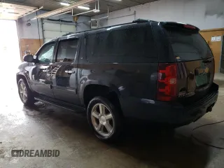 2013 Chevrolet Suburban LT with VIN 1GNSKJE75DR191647, listed as a Copart auction lot 54132905 with 127,916 mi miles and Clean title. Bid and sale history available at DreamBid. Image 2.