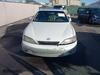 2000 Lexus ES 300 with VIN JT8BF28G9Y0282007, listed as a IAAI auction lot 41702668 with 154,025 mi miles. Bid and sale history available at carsss.com. Image 6.