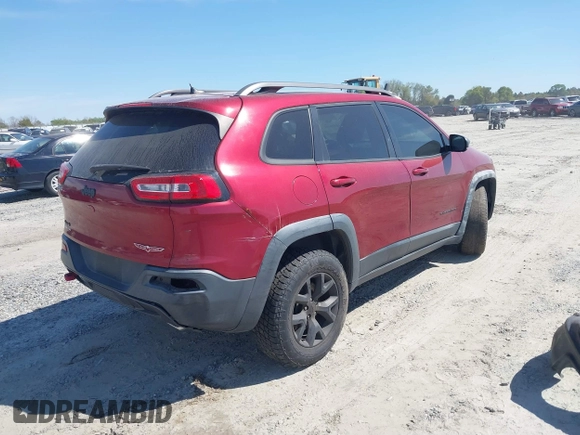 2015 Jeep Cherokee Trailhawk with VIN 1C4PJMBS1FW640483, listed as a IAAI auction lot 41883688 with 103,589 mi miles. Bid and sale history available at carsss.com. Image 4.