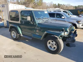 2000 Jeep Wrangler Sahara with VIN 1J4FA59S0YP795198, listed as a Copart auction lot 87920205 with 150,148 mi miles and Salvage Title. Bid and sale history available at carsss.com. Image 4.