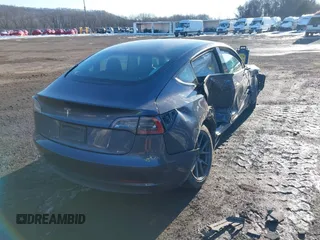 2023 Tesla Model 3 with VIN 5YJ3E1EA7PF509567, listed as a IAAI auction lot 41422396 with 28,914 mi miles. Bid and sale history available at carsss.com. Image 4.