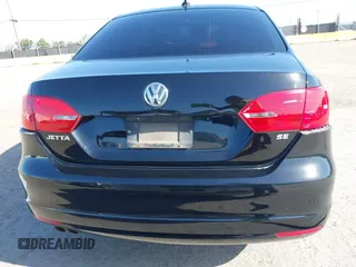 2014 Volkswagen Jetta SE z VIN 3VWD17AJ4EM419839, wystawiony jako IAAI lot #41994141 z przebiegiem 102 068 mil mil oraz . Historia ofert i sprzedaży dostępna na DreamBid. Obrazek 16.