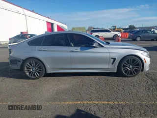 2015 BMW 4 Series 428i with VIN WBA4A5C58FG051293, listed as a IAAI auction lot 41255541 with 60,737 mi miles and . Bid and sale history available at DreamBid. Image 14.