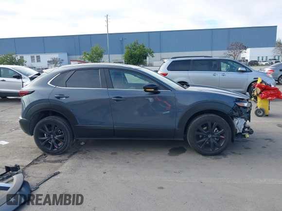 2023 Mazda CX-30 S Carbon Edition with VIN 3MVDMBCM7PM589019, listed as a IAAI auction lot 41251168 with 23,847 mi miles and . Bid and sale history available at DreamBid. Image 14.