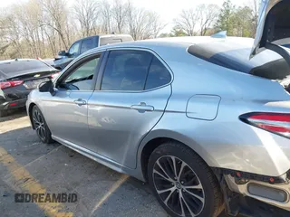 2019 Toyota Camry LE z VIN 4T1B11HK8KU681713, wystawiony jako IAAI lot #41823019 z przebiegiem 99 000 mil mil oraz . Historia ofert i sprzedaży dostępna na DreamBid. Obrazek 14.