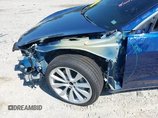 2019 Tesla Model 3 Mid Range with VIN 5YJ3E1EA6KF402308, listed as a IAAI auction lot 40077902 with 89,794 mi miles and . Bid and sale history available at carsss.com. Image 6.