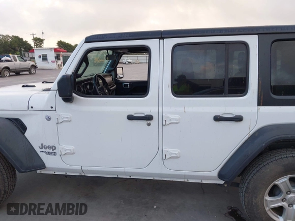 2019 Jeep Wrangler Unlimited Sport S with VIN 1C4HJXDG2KW500662, listed as a IAAI auction lot 42571152 with 45,067 mi miles and . Bid and sale history available at DreamBid. Image 14.