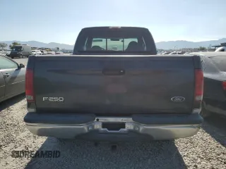1999 Ford F-250 XL with VIN 1FTNX21L0XED19451, listed as a Copart auction lot 65787795 with 140,812 mi miles and Clean title. Bid and sale history available at DreamBid. Image 6.