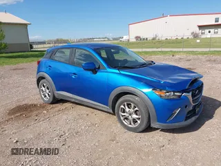 2016 Mazda CX-3 Sport z VIN JM1DKFB73G0140286, wystawiony jako IAAI lot #42235327 z przebiegiem 83 430 mil mil oraz . Historia ofert i sprzedaży dostępna na DreamBid. Obrazek 1.