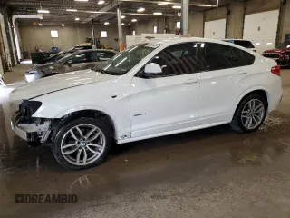 2015 BMW X4 xDrive28i with VIN 5UXXW3C58F0M87784, listed as a Copart auction lot 59852445 with 147,400 mi miles and Salvage title. Bid and sale history available at DreamBid. Image 1.
