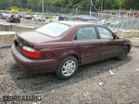 2000 Mazda 626 LX z VIN 1YVGF22C4Y5112874, wystawiony jako Copart lot #58952175 z przebiegiem 100 070 mil mil oraz Szkoda całkowita • Salvage title. Historia ofert i sprzedaży dostępna na DreamBid. Obrazek 3.