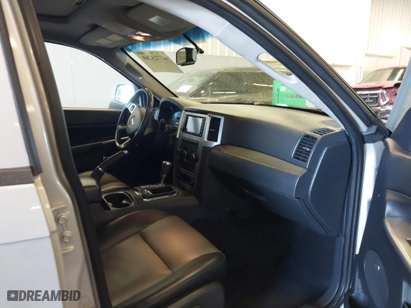 2010 Jeep Grand Cherokee Laredo with VIN 1J4RR4GT9AC106381, listed as a IAAI auction lot 41723268 with 180,008 mi miles. Bid and sale history available at carsss.com. Image 5.