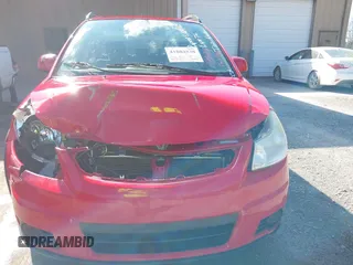 2010 Suzuki SX4 with VIN JS2YB5A34A6301801, listed as a IAAI auction lot 41884838 with 124,381 mi miles. Bid and sale history available at carsss.com. Image 6.