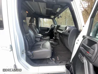 2016 Jeep Wrangler Unlimited 75th Anniversary with VIN 1C4BJWEG5GL215915, listed as a Copart auction lot 52680895 with 143,836 mi miles and Clean Title. Bid and sale history available at carsss.com. Image 5.