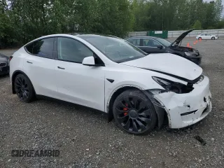 2022 Tesla Model Y Performance with VIN 7SAYGDEFXNF396758, listed as a Copart auction lot 59006365 with 47,882 mi miles and Salvage title. Bid and sale history available at DreamBid. Image 4.