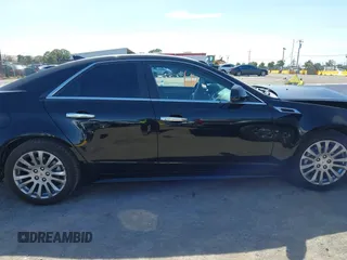 2012 Cadillac CTS Performance z VIN 1G6DJ5E30C0156576, wystawiony jako IAAI lot #42287858 z przebiegiem 106 497 mil mil oraz . Historia ofert i sprzedaży dostępna na DreamBid. Obrazek 14.