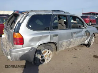 2004 GMC Envoy SLT with VIN 1GKDT13S742133932, listed as a IAAI auction lot 41598339 with 168,651 mi miles and . Bid and sale history available at DreamBid. Image 4.