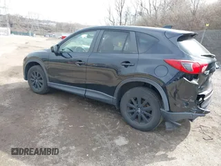 2015 Mazda CX-5 Touring with VIN JM3KE4CY2F0445178, listed as a IAAI auction lot 41828953 with 137,330 mi miles and . Bid and sale history available at DreamBid. Image 3.