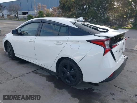 2021 Toyota Prius L Eco z VIN JTDKAMFU9M3131228, wystawiony jako IAAI lot #41257117 z przebiegiem 72 840 mil mil oraz . Historia ofert i sprzedaży dostępna na DreamBid. Obrazek 3.