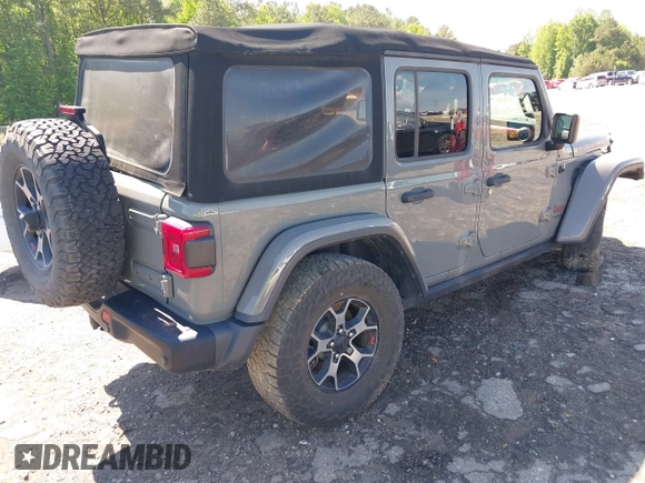 2018 Jeep Wrangler Unlimited Rubicon with VIN 1C4HJXFG6JW267087, listed as a IAAI auction lot 42235058 with 93,962 mi miles and . Bid and sale history available at DreamBid. Image 4.
