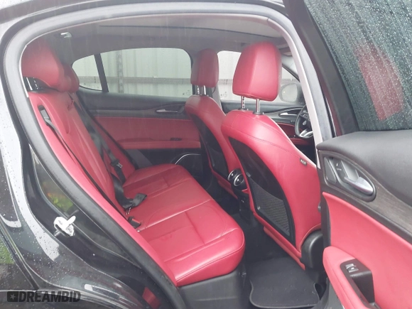 2021 Alfa Romeo Stelvio Ti with VIN ZASPAKBN0M7D02795, listed as a IAAI auction lot 41052309 with 83,584 mi miles. Bid and sale history available at carsss.com. Image 8.