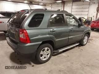 2009 Kia Sportage LX with VIN KNDJE723097558182, listed as a IAAI auction lot 41295142 with 147,200 mi miles. Bid and sale history available at carsss.com. Image 4.
