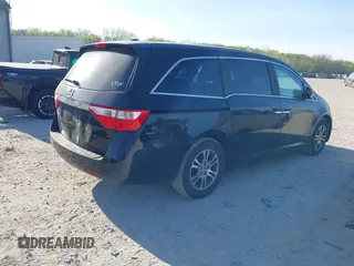 2012 Honda Odyssey EX-L with VIN 5FNRL5H6XCB016801, listed as a IAAI auction lot 42112141 with 164,671 mi miles and . Bid and sale history available at carsss.com. Image 4.