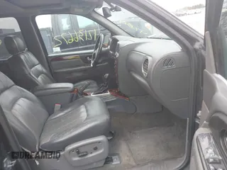 2002 GMC Envoy SLT with VIN 1GKDT13S222143135, listed as a IAAI auction lot 42136672 with 206,064 mi miles. Bid and sale history available at carsss.com. Image 5.
