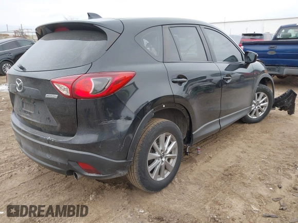 2015 Mazda CX-5 Sport with VIN JM3KE4BY9F0495948, listed as a IAAI auction lot 41501840 with 145,959 mi miles. Bid and sale history available at carsss.com. Image 4.
