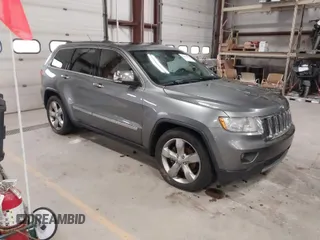 2013 Jeep Grand Cherokee Overland with VIN 1C4RJFCT9DC524605, listed as a IAAI auction lot 42016103 with 215,352 mi miles. Bid and sale history available at carsss.com. Image 1.