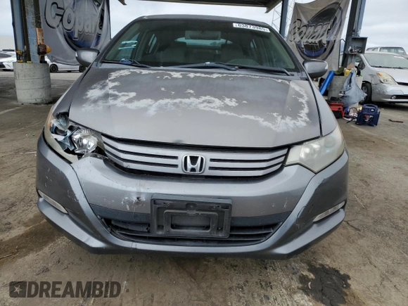 2011 Honda Insight EX with VIN JHMZE2H77BS006079, listed as a Copart auction lot 63873985 with 134,159 mi miles and Salvage title. Bid and sale history available at DreamBid. Image 5.