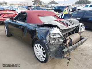 2001 Toyota MR2 Spyder with VIN JTDFR320710035330, listed as a IAAI auction lot 41238516 with 160,405 mi miles. Bid and sale history available at carsss.com. Image 3.