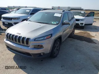 2016 Jeep Cherokee Latitude with VIN 1C4PJLCB7GW256587, listed as a IAAI auction lot 42037539 with 209,267 mi miles. Bid and sale history available at carsss.com. Image 2.