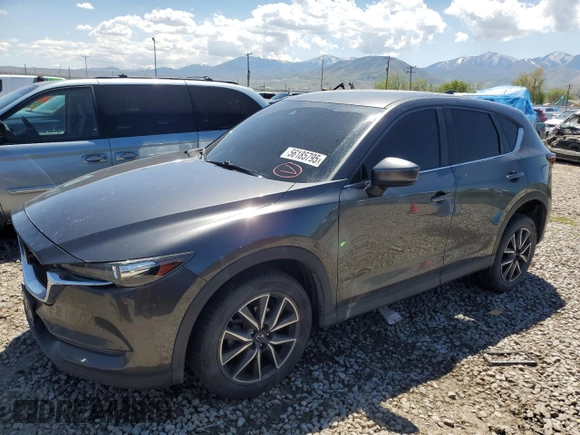 2018 Mazda CX-5 Touring z VIN JM3KFACM5J0338126, wystawiony jako Copart lot #56185795 z przebiegiem 115 254 mil mil oraz Szkoda całkowita • Salvage title. Historia ofert i sprzedaży dostępna na DreamBid. Obrazek 1.