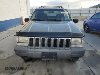 1996 Jeep Grand Cherokee Laredo with VIN 1J4GZ58S3TC245928, listed as a Copart auction lot 57313735 with 165,733 mi miles and Salvage title. Bid and sale history available at DreamBid. Image 5.