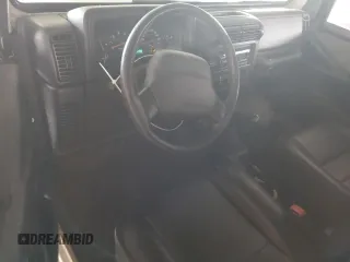 2002 Jeep Wrangler SE with VIN 1J4FA29P12P700276, listed as a Copart auction lot 45109175 with 115,139 mi miles and Salvage Title. Bid and sale history available at DreamBid. Image 8.