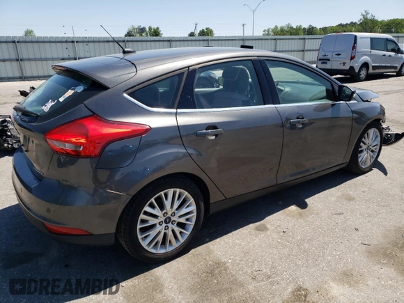 2016 Ford Focus Titanium with VIN 1FADP3N27GL201482, listed as a Copart auction lot 51768335 with 54,463 mi miles and Salvage title. Bid and sale history available at DreamBid. Image 3.