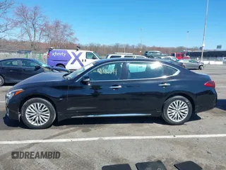 2015 Infiniti Q70 z VIN JN1BY1PR9FM831643, wystawiony jako IAAI lot #41886744 z przebiegiem 58 884 mil mil oraz . Historia ofert i sprzedaży dostępna na DreamBid. Obrazek 14.