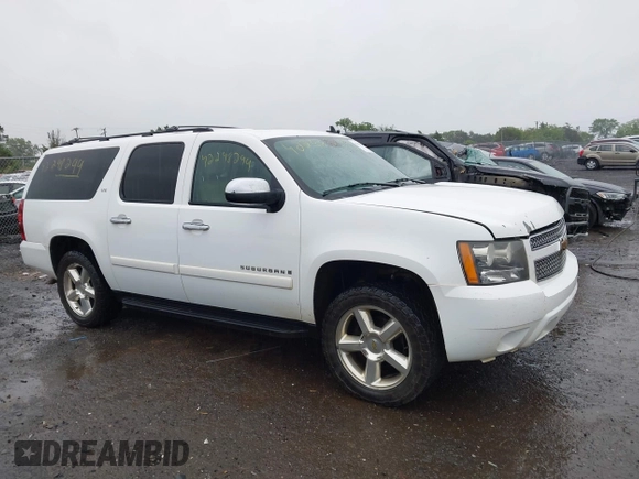 2008 Chevrolet Suburban LTZ z VIN 3GNFK16338G185462, wystawiony jako IAAI lot #42298299 z przebiegiem 301 758 mil mil oraz . Historia ofert i sprzedaży dostępna na DreamBid. Obrazek 13.