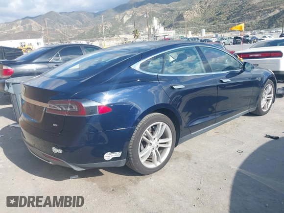 2013 Tesla Model S with VIN 5YJSA1CN8DFP07177, listed as a IAAI auction lot 42127797 with 75,227 mi miles and . Bid and sale history available at DreamBid. Image 4.