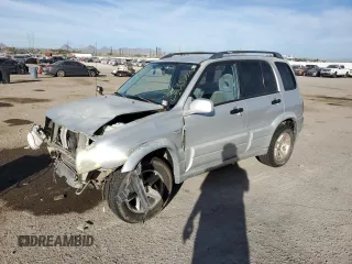 2003 Suzuki Grand Vitara z VIN JS3TE62V834101084, wystawiony jako Copart lot #86354164 z przebiegiem 132 241 mil mil oraz Szkoda całkowita • Salvage title. Historia ofert i sprzedaży dostępna na DreamBid. Obrazek 1.