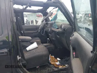 2014 Jeep Wrangler Unlimited Sport with VIN 1C4BJWDGXEL294965, listed as a IAAI auction lot 41908152 with 243,546 mi miles and . Bid and sale history available at DreamBid. Image 5.