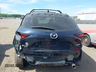 2017 Mazda CX-5 Touring z VIN JM3KFBCL5H0133493, wystawiony jako IAAI lot #39666644 z przebiegiem 125 048 mil mil oraz . Historia ofert i sprzedaży dostępna na DreamBid. Obrazek 6.