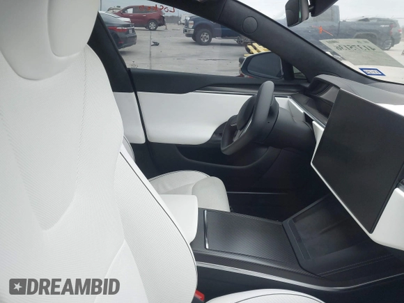 2021 Tesla Model S Plaid z VIN 5YJSA1E64MF452744, wystawiony jako IAAI lot #41375136 z przebiegiem Nie podano mil oraz . Historia ofert i sprzedaży dostępna na DreamBid. Obrazek 5.