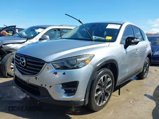 2016 Mazda CX-5 Grand Touring with VIN JM3KE4DY9G0795360, listed as a IAAI auction lot 41933991 with 176,373 mi miles. Bid and sale history available at carsss.com. Image 17.